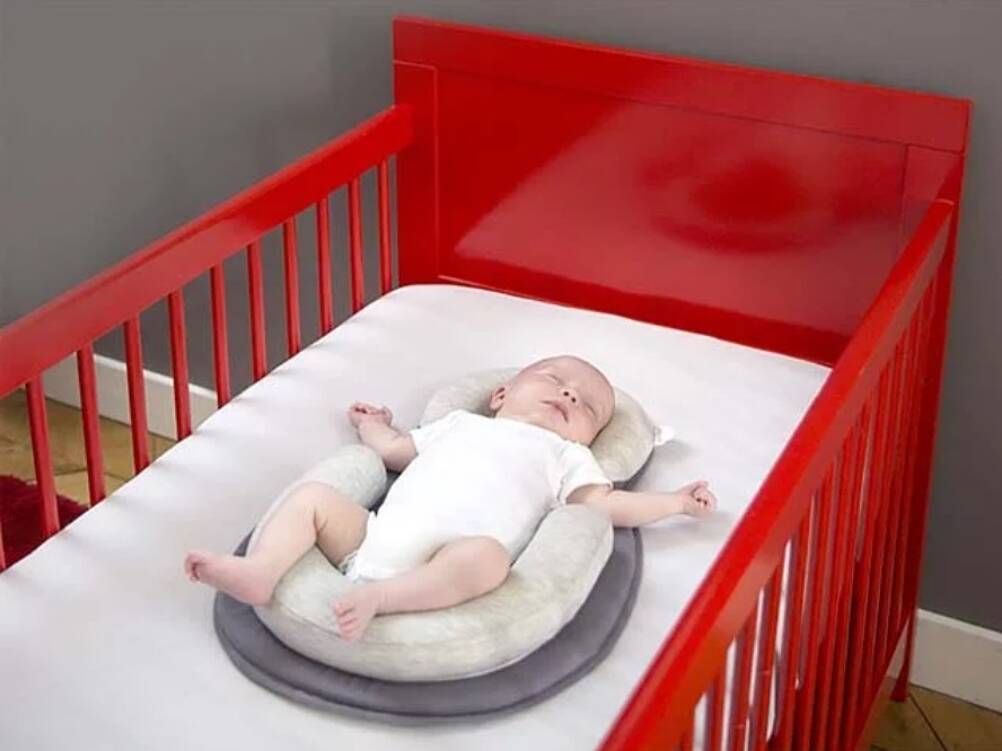 Réducteur de lit et cale bébé